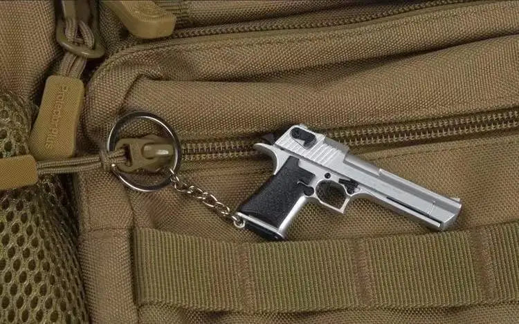 Metal 1:4 scale Desert Eagle style model keychain attached to bag, alloy collectible accessory