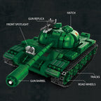 Green toy tank model with labeled parts on a dark background
