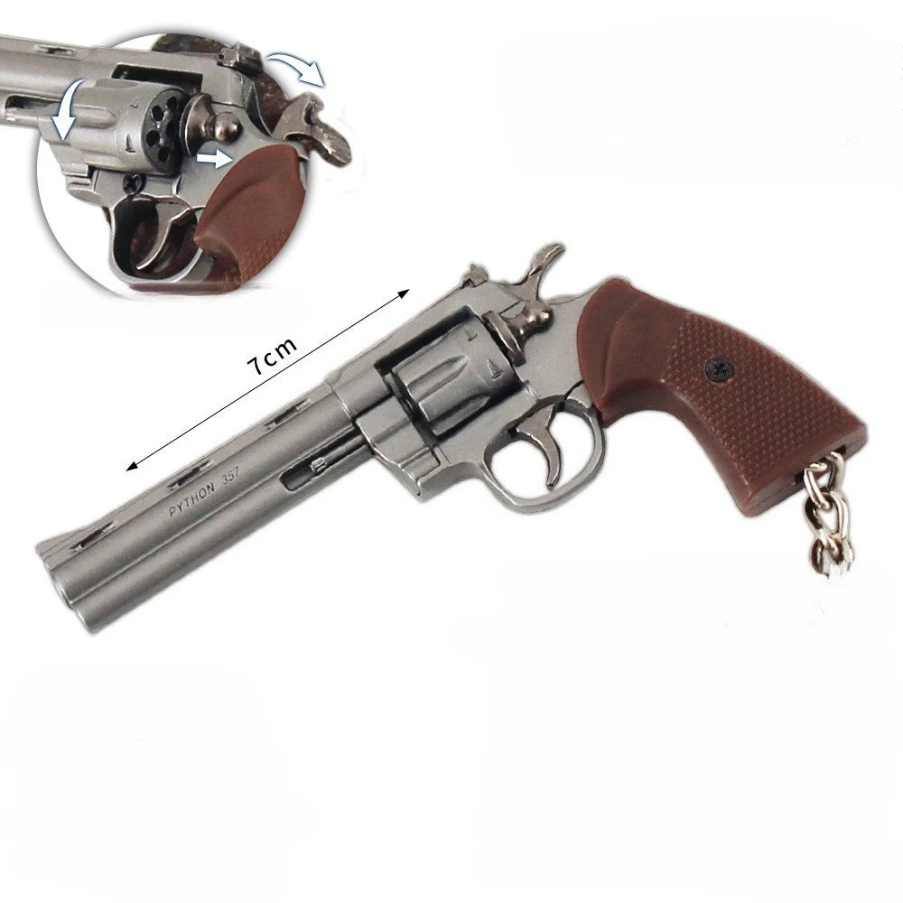 Gunmetal alloy revolver keychain with brown grip, rotating cylinder and 7cm size reference