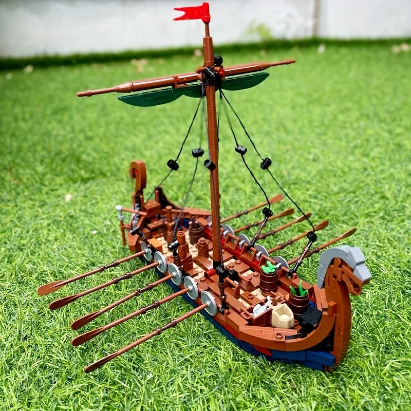 Side view of MOC medieval Viking ship building blocks displayed on grass, detailed ocean adventure boat model by Toylvia