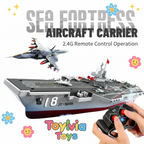 Toy aircraft carrier with remote control and 'Sea Fortress' branding, featuring a fighter jet on top.