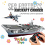 Toy aircraft carrier with remote control and 'Sea Fortress' branding, featuring a fighter jet on top.