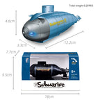Toy submarine with packaging, showing dimensions and brand name.