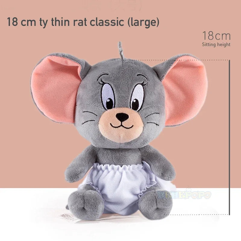 Plush toy mouse with large ears on a beige background