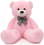 Pink teddy bear with a black and white checkered bow tie on a white background