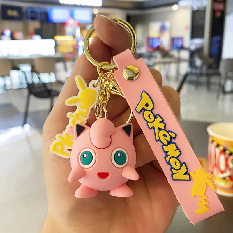 Jigglypuff Pokémon plush keychain hanger with pink strap held in hand