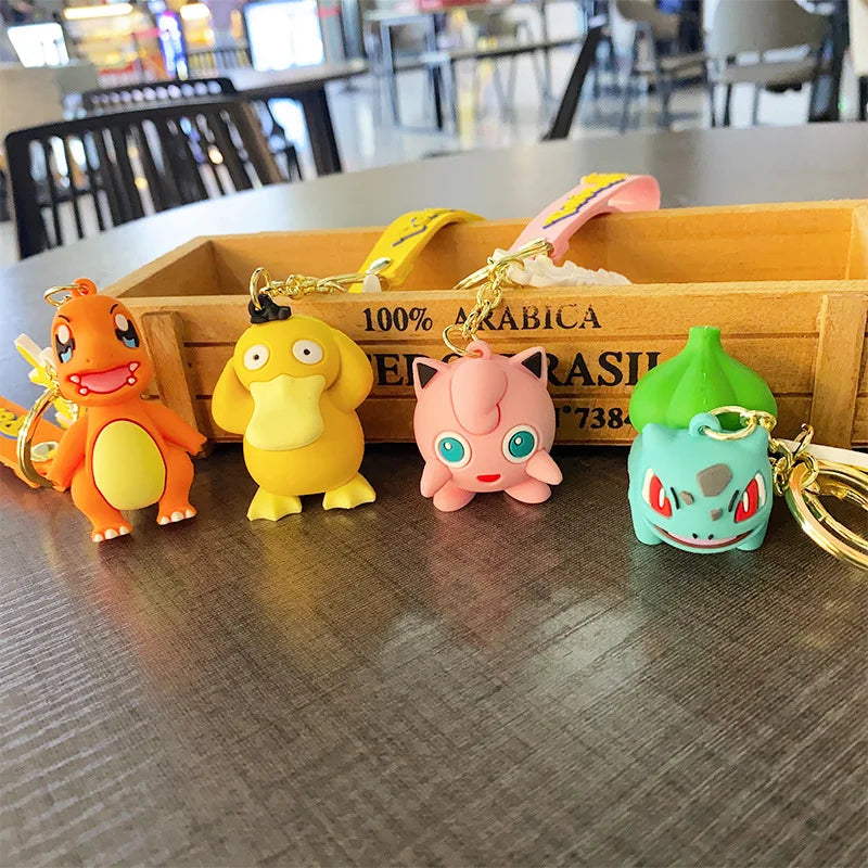 Charmander, Psyduck, Jigglypuff and Bulbasaur Pokémon plush keychain hangers displayed on table