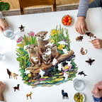 Detailed view of the precision laser-cut edges on the wooden otter family puzzle pieces.