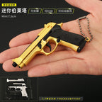 Gold and black toy gun held in a hand with text on a dark background