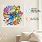 Colorful butterfly and floral design in a white frame on a wall with text about laser cutting and UV printing.