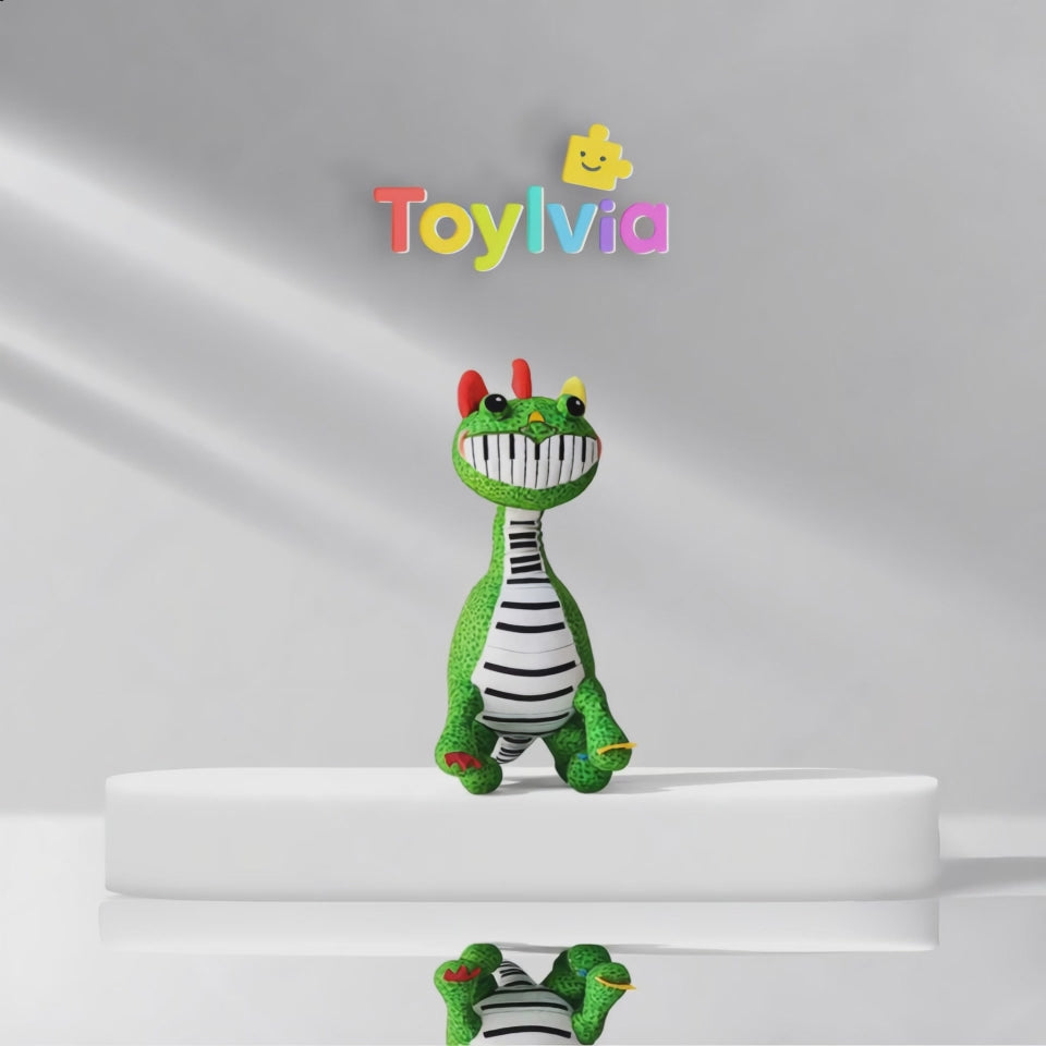 Video showcase of the green Pianosaurus stuffed monster doll with a piano-keyboard smile.
