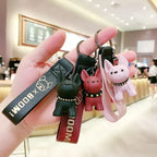Punk French bulldog keychains in black, red, and pink held in hand, PU leather dog bag and car keyrings