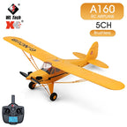 Yellow RC airplane with remote control on a white background, featuring WL Tech XK branding.