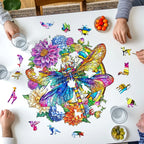Colorful puzzle with a butterfly design on a table, surrounded by hands and small dishes.