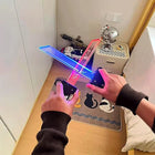 A person holding red and blue illuminated toy swords crossed in front of them indoors.