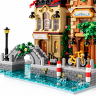 Close-up of the Riverside Bistro & Hair Salon building block set's canal bridge, promenade, and facade