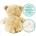 Beige teddy bear with eco-friendly stuffing label on a white background