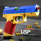 Toy gun made of interlocking bricks with 'USP' branding on a dark surface.