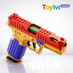 Detailed close-up of the red slide and green chamber of the SIG17 brick toy gun.