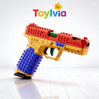 High-angle side view of the SIG17 toy gun made from red and yellow interlocking bricks.