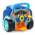 Rear cockpit view of the blue mechanic playset with steering wheel and dashboard.