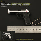 Miniature Beretta gun model with detachable pullable trigger on a black background, accompanied by a ruler for scale.