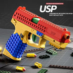 Toy gun made of interlocking building blocks with 'USP' branding on a dark surface.