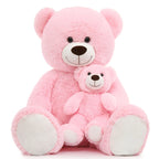 Two pink teddy bears of different sizes on a white background