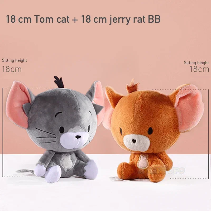 Two plush toys, one gray and one brown, sitting on a white surface with a pink background.