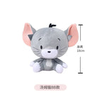 Plush toy resembling a cat with measurement details on a white background