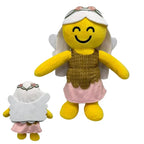 Toylvia Angel Fairy Plush – front and back view of smiling yellow plush doll with white wings, pink dress, floral headband, and brown knitted vest on white background