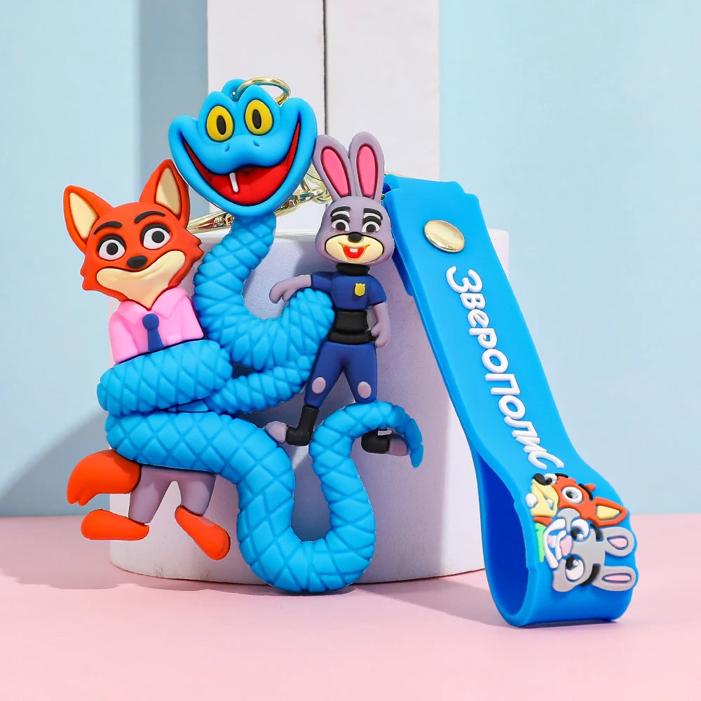 Blue cartoon snake keychain wrapping small animal figures, silicone keychain with strap on pastel background