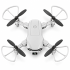 Overhead view of the light-gray quadcopter with four propellers and curved guards.
