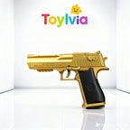 An angled studio shot of a gold Toylvia toy handgun with a black grip, displayed in a bright white minimalist setting.