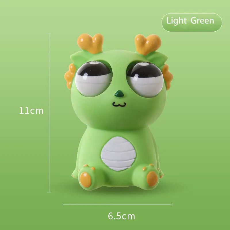 Light green pop-out eyes dragon squeeze fidget toy with size measurements shown on green background