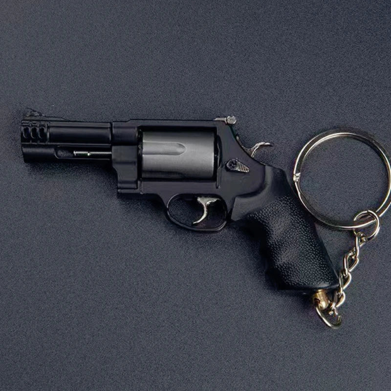 Mini M500 revolver metal keychain collectible in black finish on dark background Main image