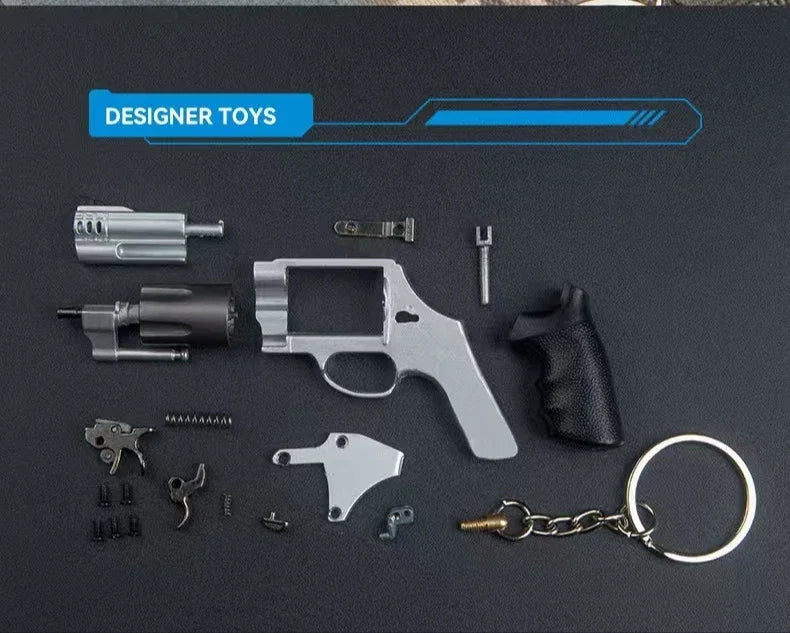 Disassembled mini M500 revolver metal keychain collectible showing detailed alloy parts