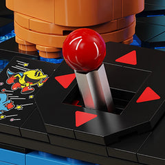 Close-up of Pac-Man building block set joystick with arcade-style red handle and printed base detail – Toylvia