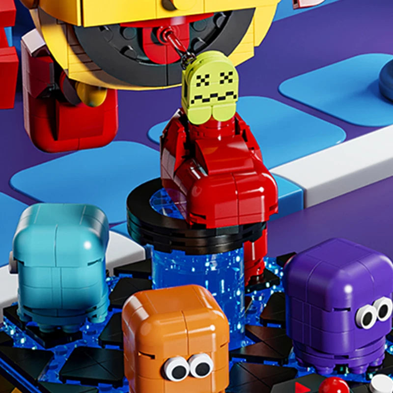 Close-up of Pac-Man building block figure biting motion with rotating ghost characters on the base – Toylvia collectible set