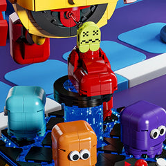 Close-up of Pac-Man building block figure biting motion with rotating ghost characters on the base – Toylvia collectible set