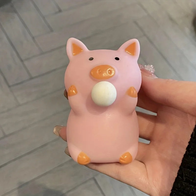 Pink pig squishy bubble fidget toy held in hand sensory stress relief toy