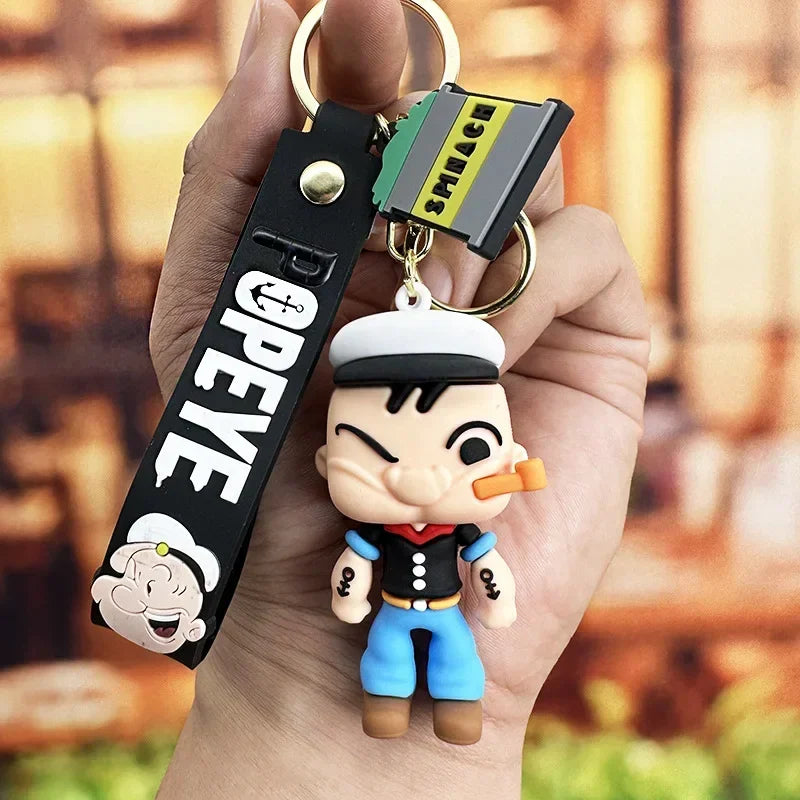 Toylvia Popeye Kawaii Keychain held in hand with cartoon PVC figure and POPEYE strap.