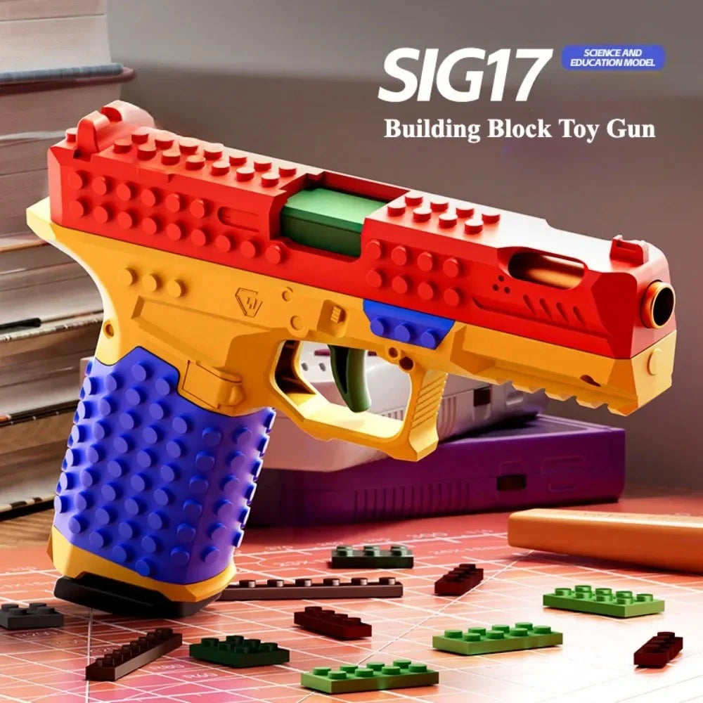 Toylvia SIG17 building block toy gun displayed with colorful blocks on the table