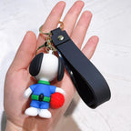 Back view of Snoopy silicone keychain in blue outfit held in hand