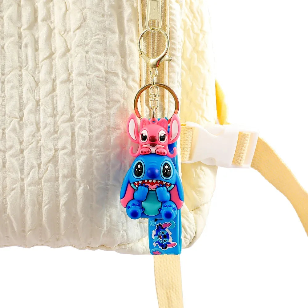 Multiple Stitch PVC keychain variants hanging on a display stand showing different character styles