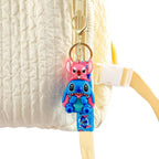 Multiple Stitch PVC keychain variants hanging on a display stand showing different character styles