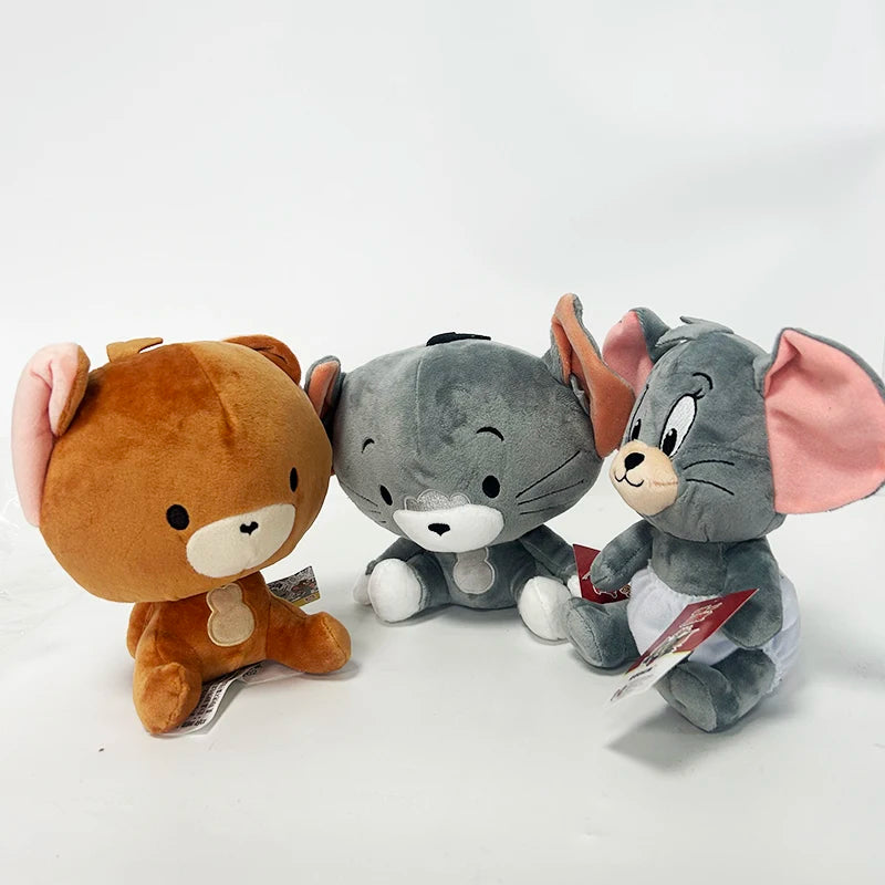 Three plush toys resembling a bear, cat, and mouse on a white background