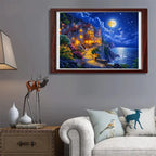 Framed artwork of a coastal scene with houses and a full moon on a wall above a sofa.