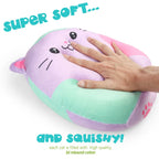 Plush cat-shaped pillow with a hand pressing on it, text indicating softness and squishiness.