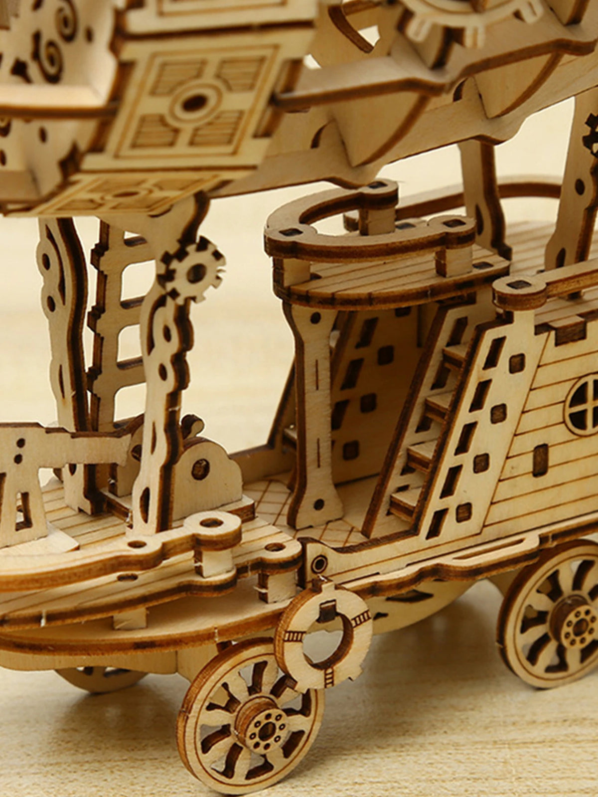 Detailed view of the wooden airship model base with wheels and mechanical parts